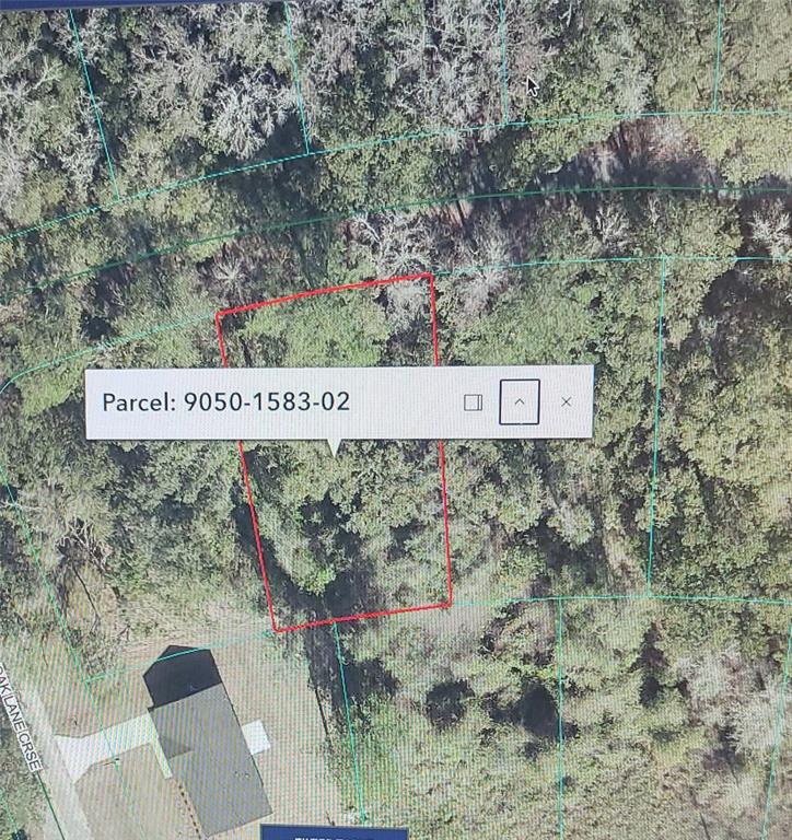This is a satellite map view showing a highlighted rectangular parcel of land — OAK LANE WAY, OCALA, FL