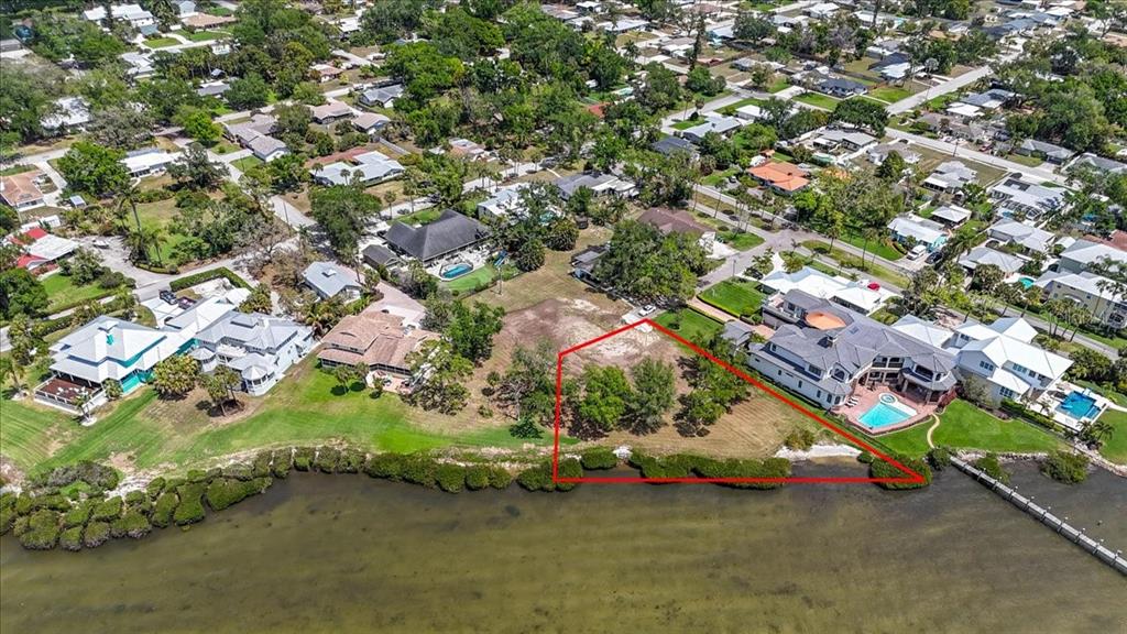A sandy shoreline meets a body of water with mangroves on the right side — 2111 4TH ST COURT W, PALMETTO, FL