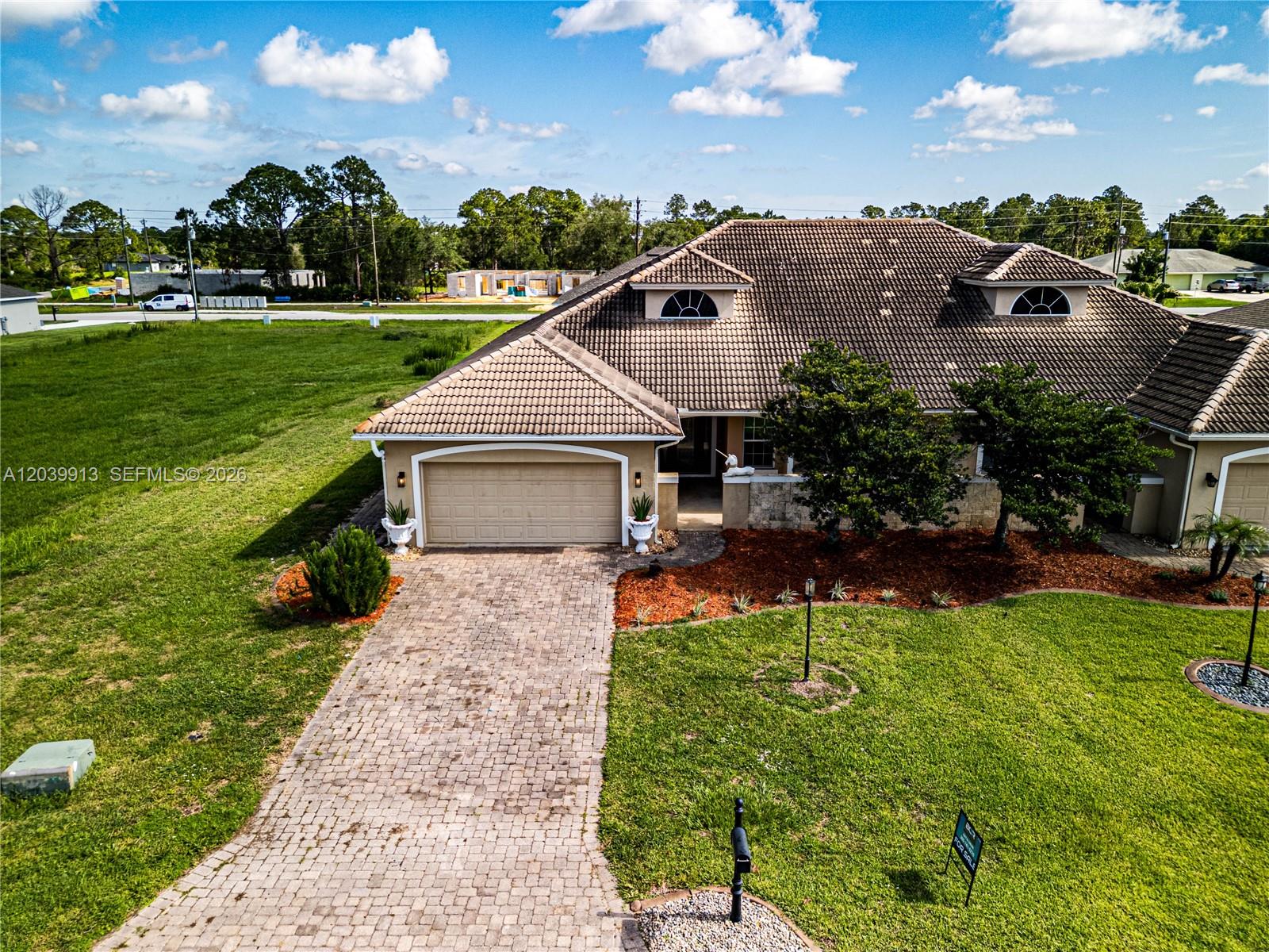 An aerial view shows a single-story house with a tiled roof and a paved driveway — 6938 Cecilia Ave, Sebring FL 33872, SEBRING, FL