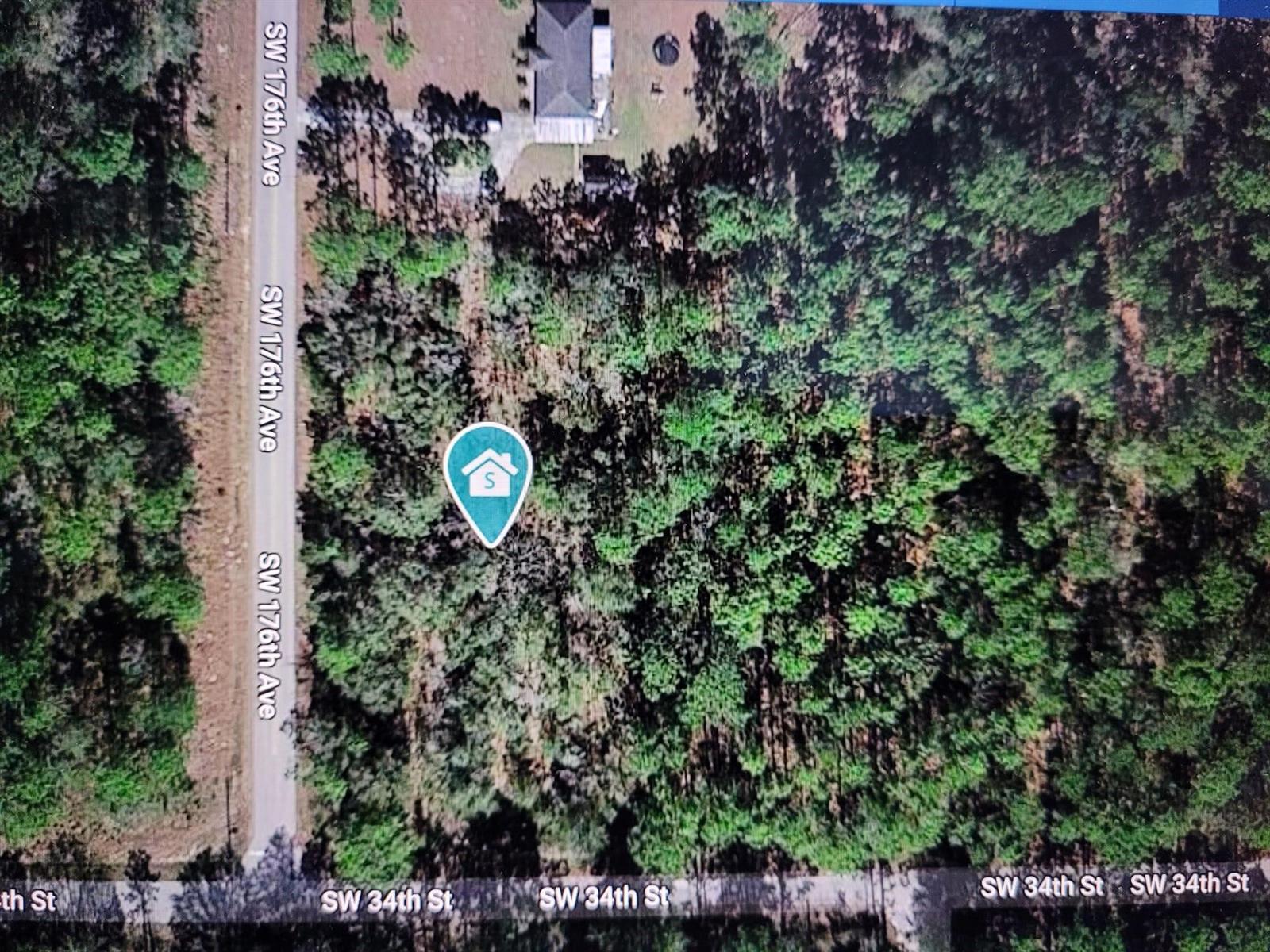 An aerial map view shows a wooded lot located at a road intersection — 0 SW 34 Street, FL 34432, FL