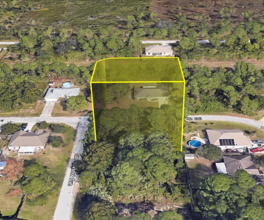 An aerial view shows a residential property highlighted by a yellow box among trees — SAN SALVADOR AVENUE SE, PALM BAY, FL