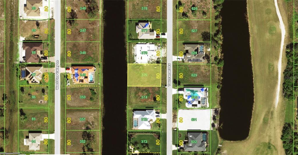 This is an aerial map showing a vacant residential lot highlighted in yellow — 243 TOURNAMENT ROAD, ROTONDA WEST, FL