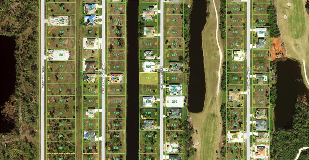 This is an aerial map showing residential lots and houses along several streets — 243 TOURNAMENT ROAD, ROTONDA WEST, FL