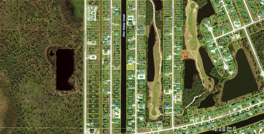 This is an aerial map showing residential lots, streets, and water features in a neighborhood — 243 TOURNAMENT ROAD, ROTONDA WEST, FL