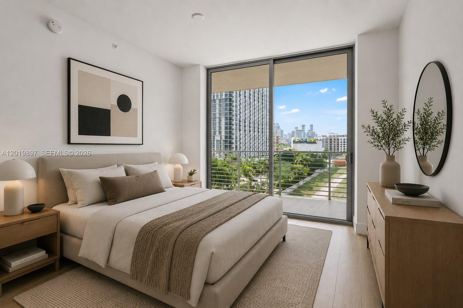A modern bedroom features a bed, wooden dresser, and a balcony with a city view — 90 NE 32nd St # 627, Miami FL 33137, MIAMI, FL