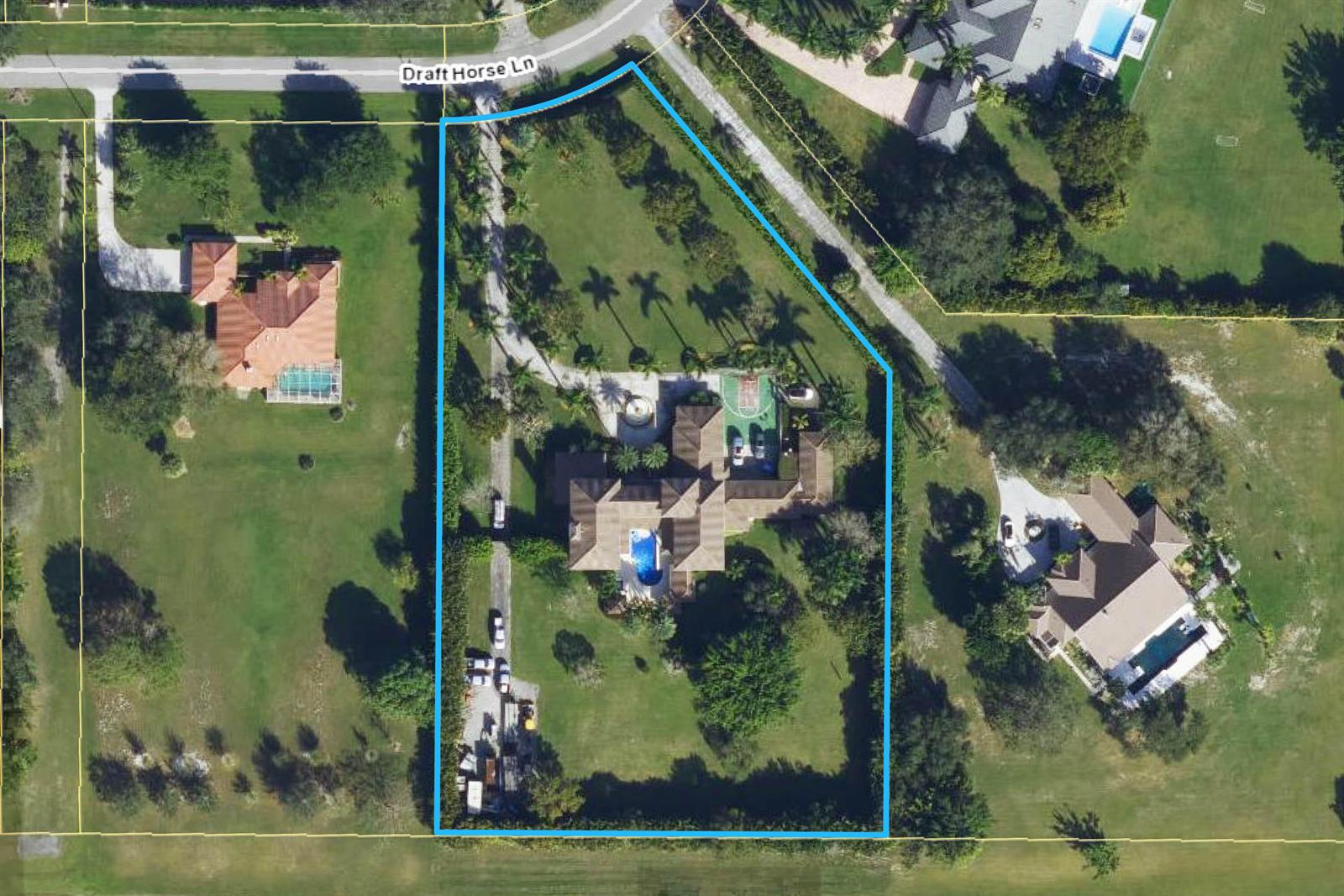 An aerial view shows a large residential property with a house, pool, and driveway — 14535 Draft Horse Lane, Wellington FL 33414, WELLINGTON, FL