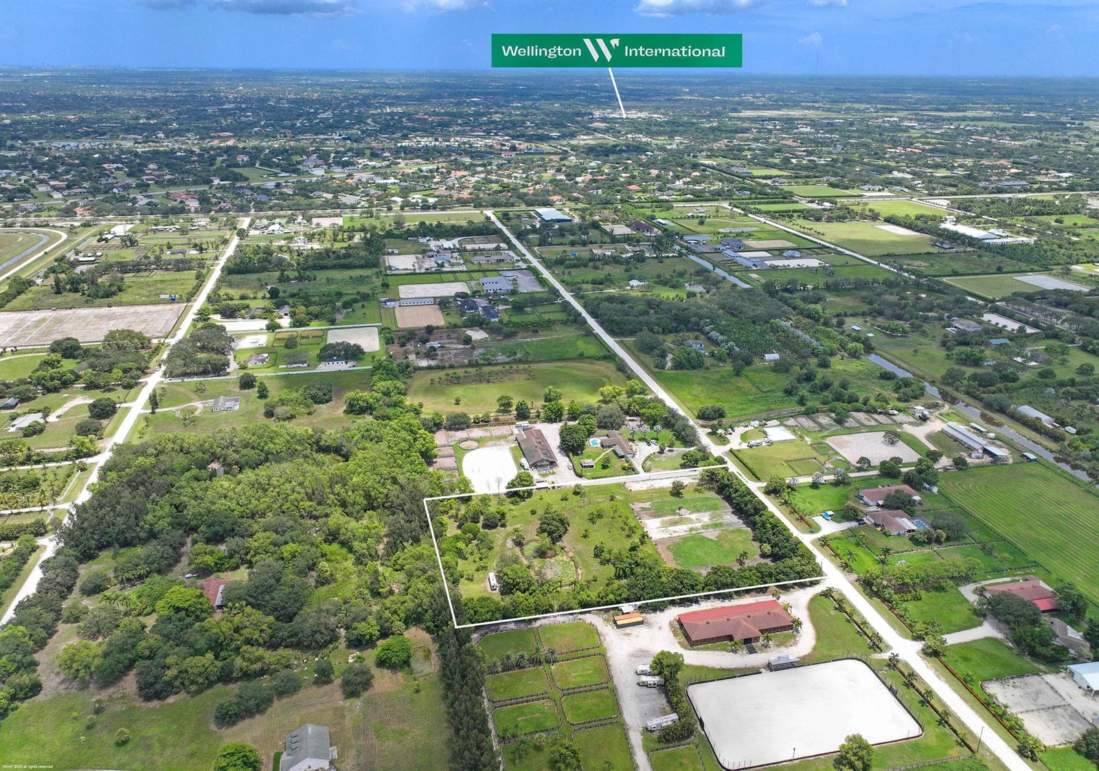 An aerial view shows a rectangular plot of land surrounded by rural properties and greenery — 16639 Hollow Tree Lane, Wellington FL 33470, WELLINGTON, FL