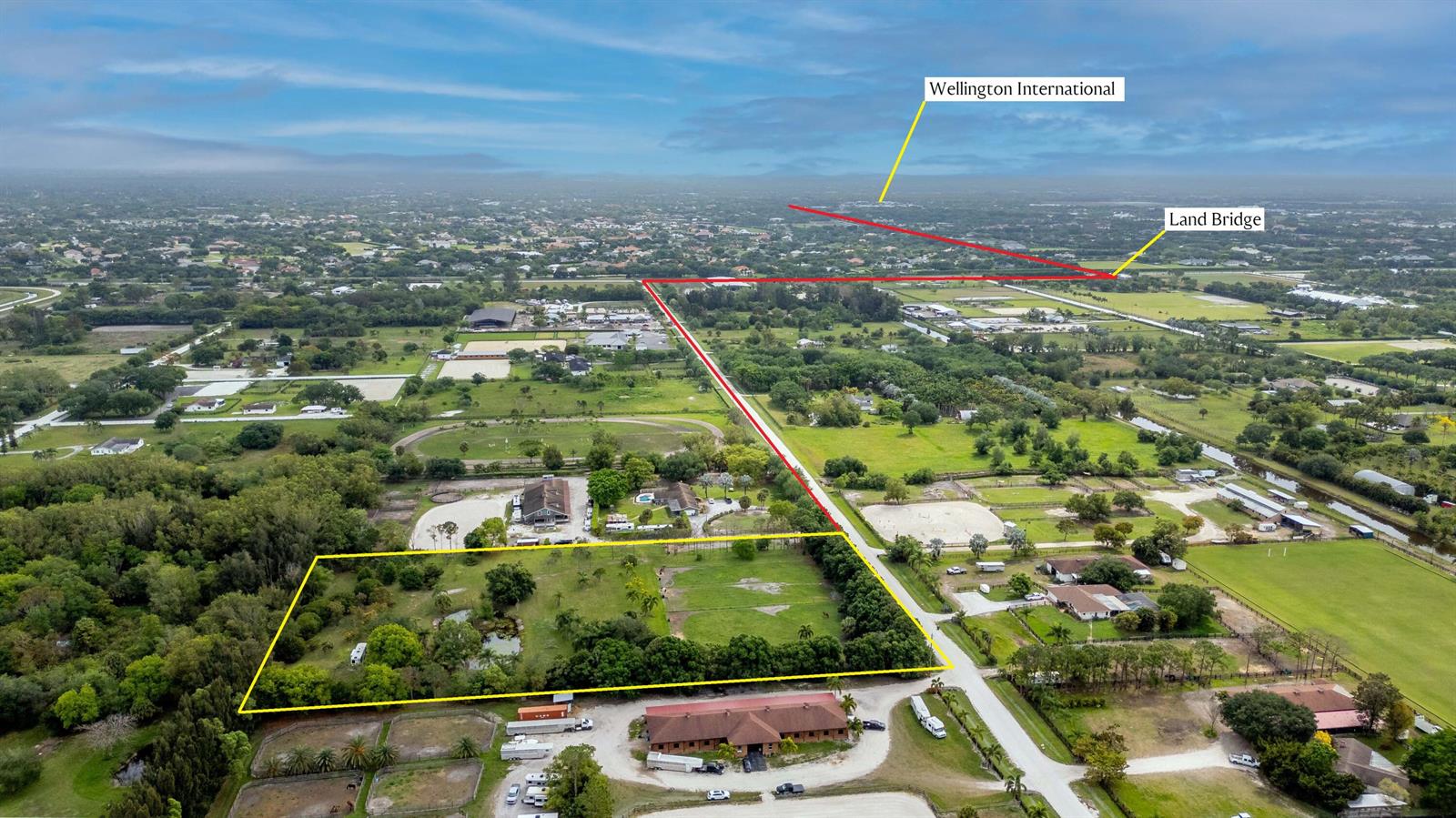 This aerial view shows a large, rectangular property outlined in yellow with surrounding equestrian facilities — 16639 Hollow Tree Lane, Wellington FL 33470, WELLINGTON, FL