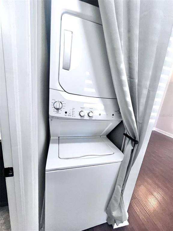 A white storm door with a glass panel is installed at the entrance of a home — 7828 HARDWICK DRIVE UNIT 927, NEW PORT RICHEY, FL