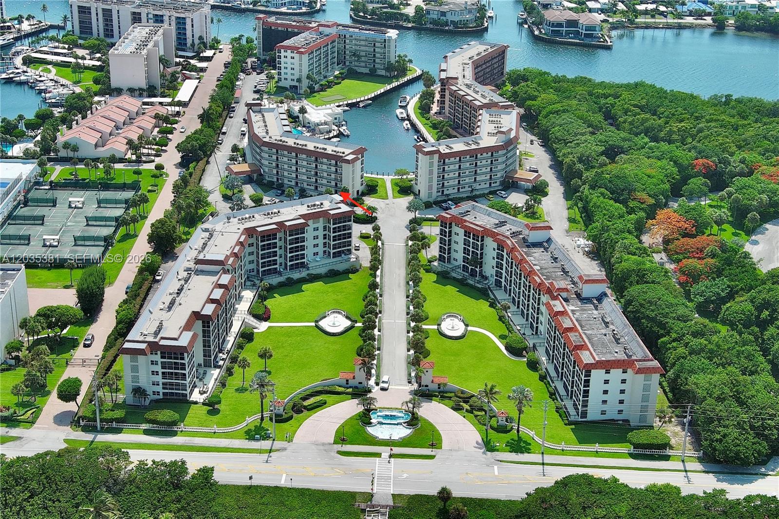 An aerial view shows a residential complex with multiple buildings, a central driveway, and landscaping — 2871 N Ocean Blvd # M126, Boca Raton FL 33431, BOCA RATON, FL
