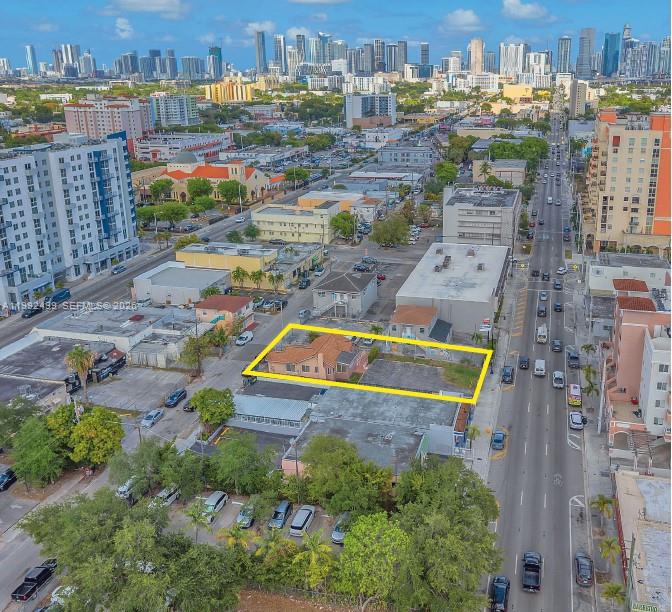 An aerial view shows a residential lot with a house and paved area outlined yellow — 1437 SW 1st St, Miami FL 33135, MIAMI, FL
