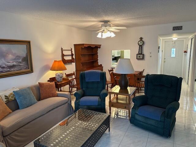 A living room with a sofa, two armchairs, a coffee table, and a dining area — 7705 NW 5th Court # 103, Margate FL 33063, MARGATE, FL