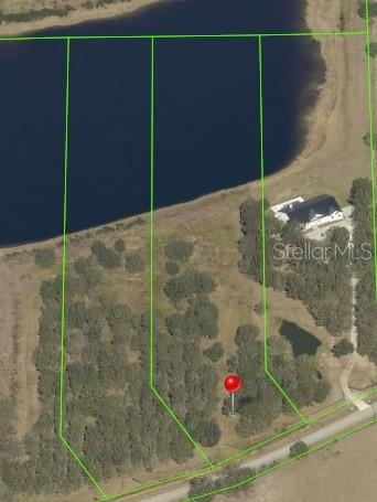 An aerial map shows a large, wooded lot with a red marker near a lake — 4946 WAUCHULA RD, MYAKKA CITY, FL