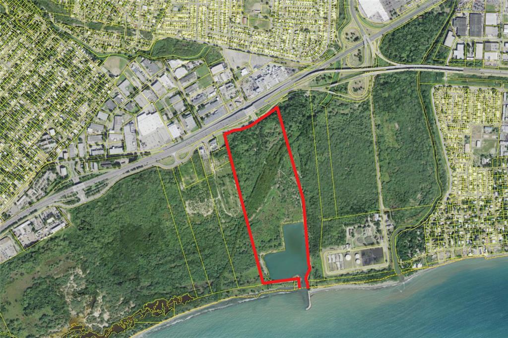 An aerial map shows a large, rectangular plot of land outlined in red near water — Lot C ROAD #2, PONCE, PR
