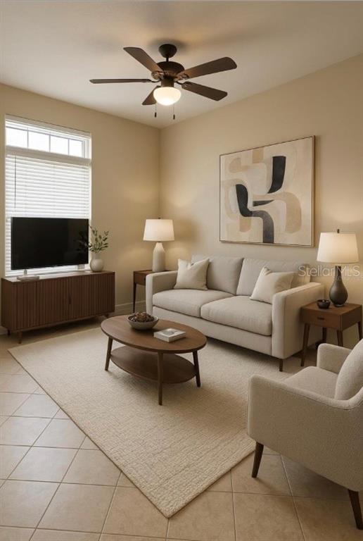 A living room features a beige sofa, coffee table, television console, and a ceiling fan — 227 ORCHID DRIVE, DAVENPORT, FL