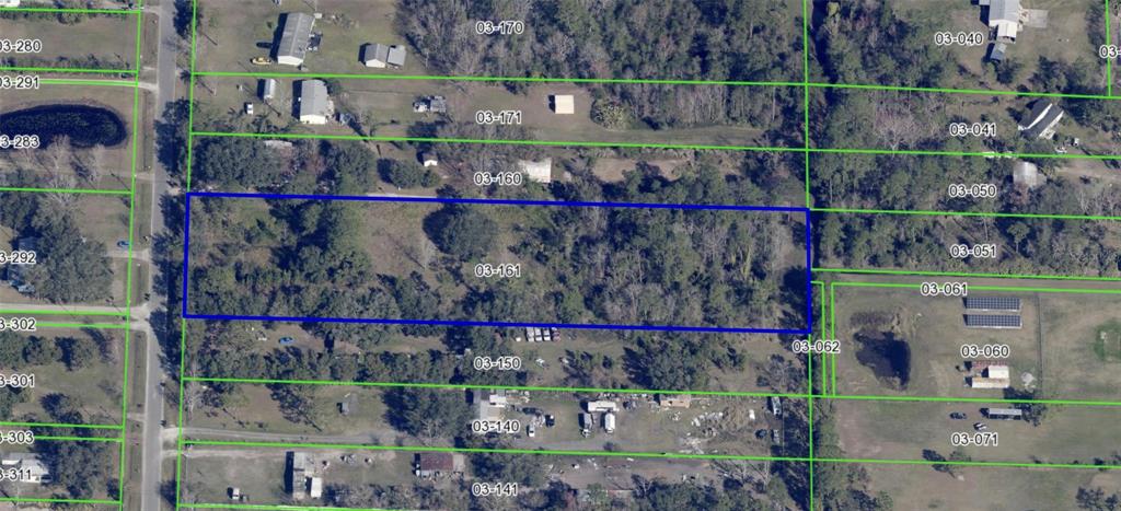 This is an aerial map showing a rectangular parcel of land highlighted in blue — 2731 8TH STREET, ORLANDO, FL