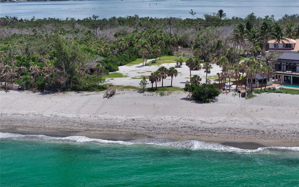 An aerial view of a sandy beach leading to a grassy lot with palm trees — 6160 MANASOTA KEY ROAD, ENGLEWOOD, FL