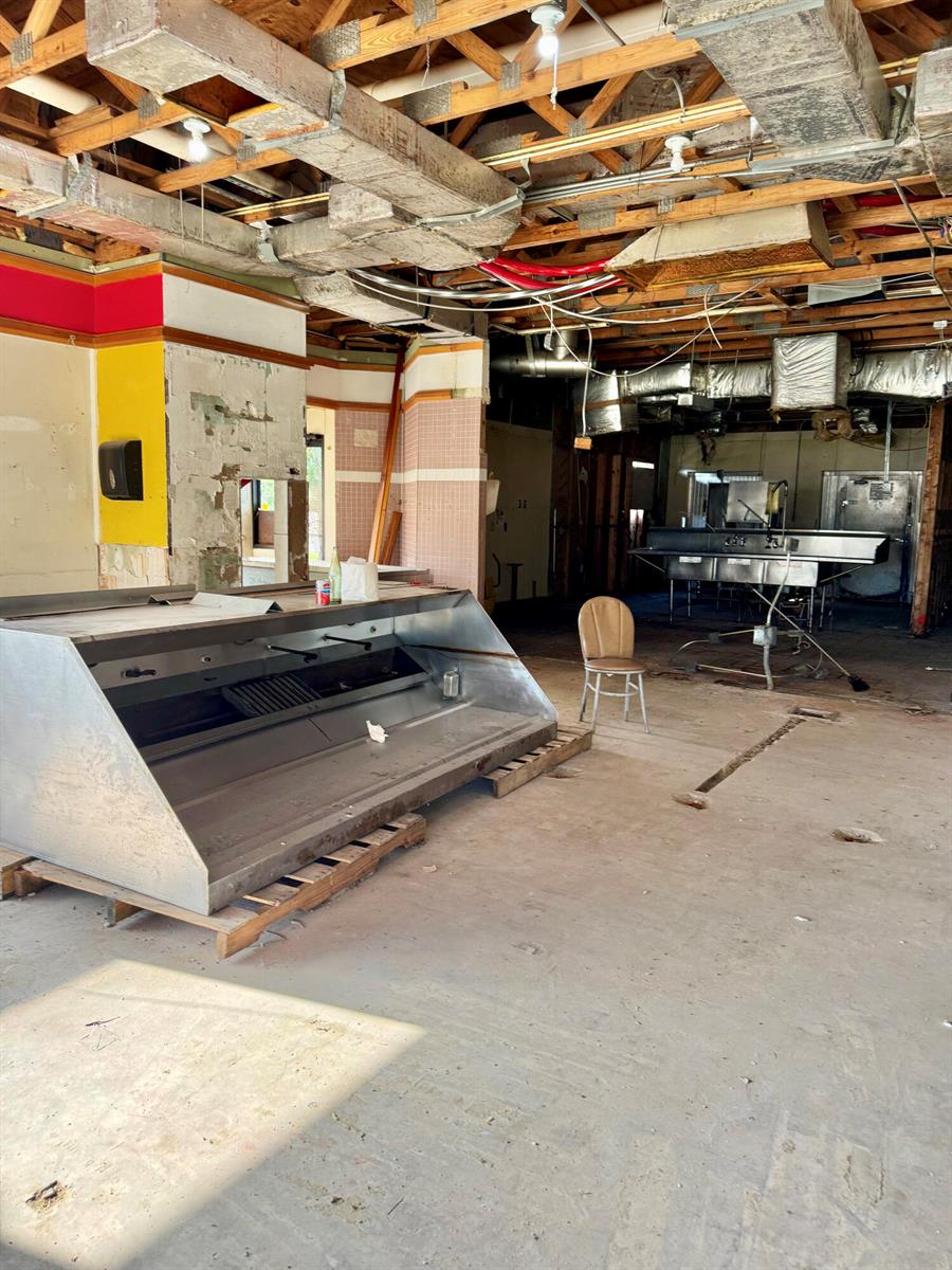 An interior view of a commercial kitchen space under renovation with exposed ceiling joists — 1520 Lakeview Drive, Sebring FL 33870, SEBRING, FL