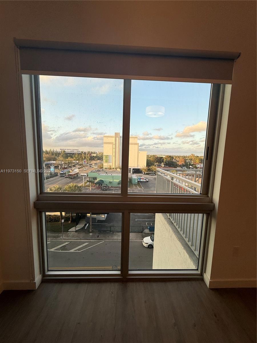 A view of a city street and a casino from a room with large windows — 61 NW 37th Ave # 22, Miami FL 33125, MIAMI, FL