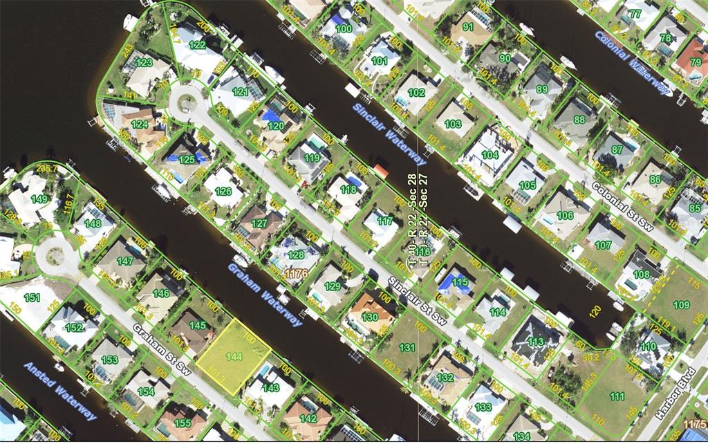 This is a satellite map showing residential lots and waterways in a neighborhood — 122 GRAHAM STREET SW, PORT CHARLOTTE, FL