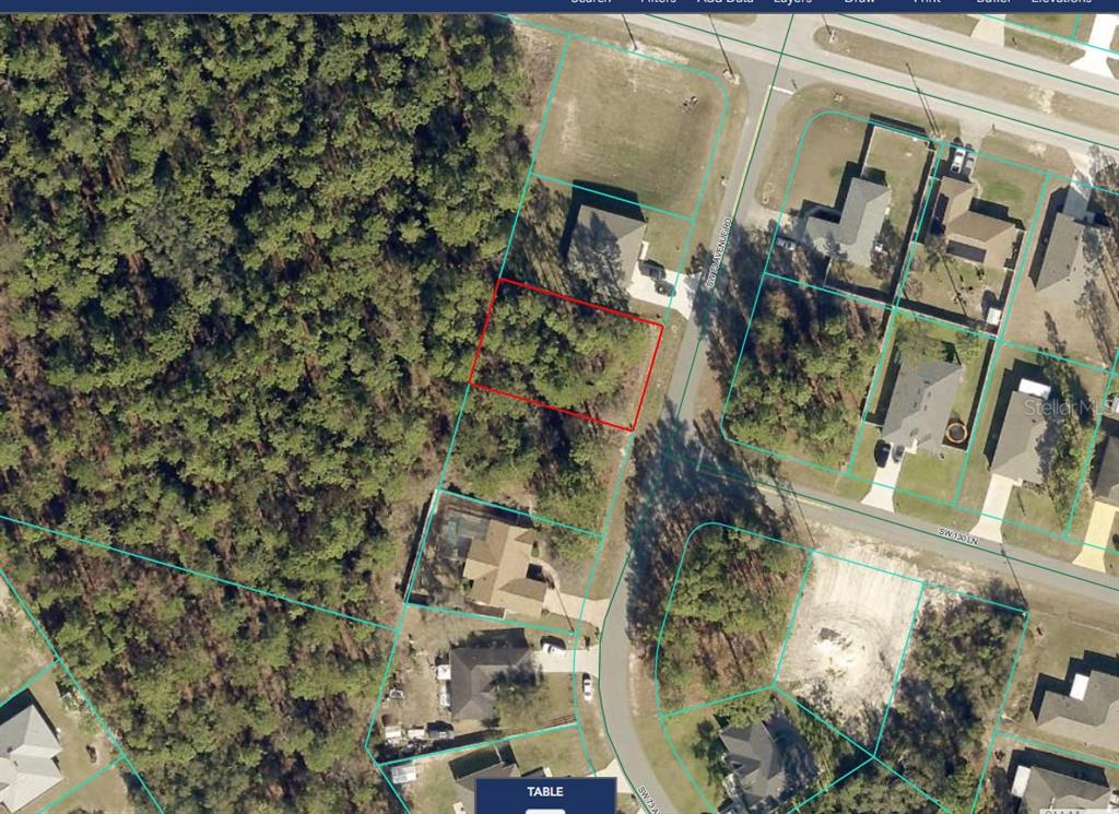 This is an aerial map showing a vacant, wooded residential lot outlined in red — TBD SW 73RD AVENUE ROAD, OCALA, FL