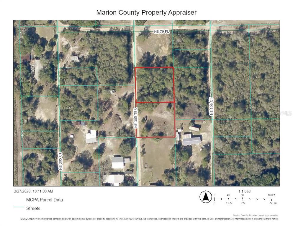 This is a property map showing two adjacent rectangular parcels of land outlined in red — 7871 NE 305TH TERRACE, FORT MC COY, FL