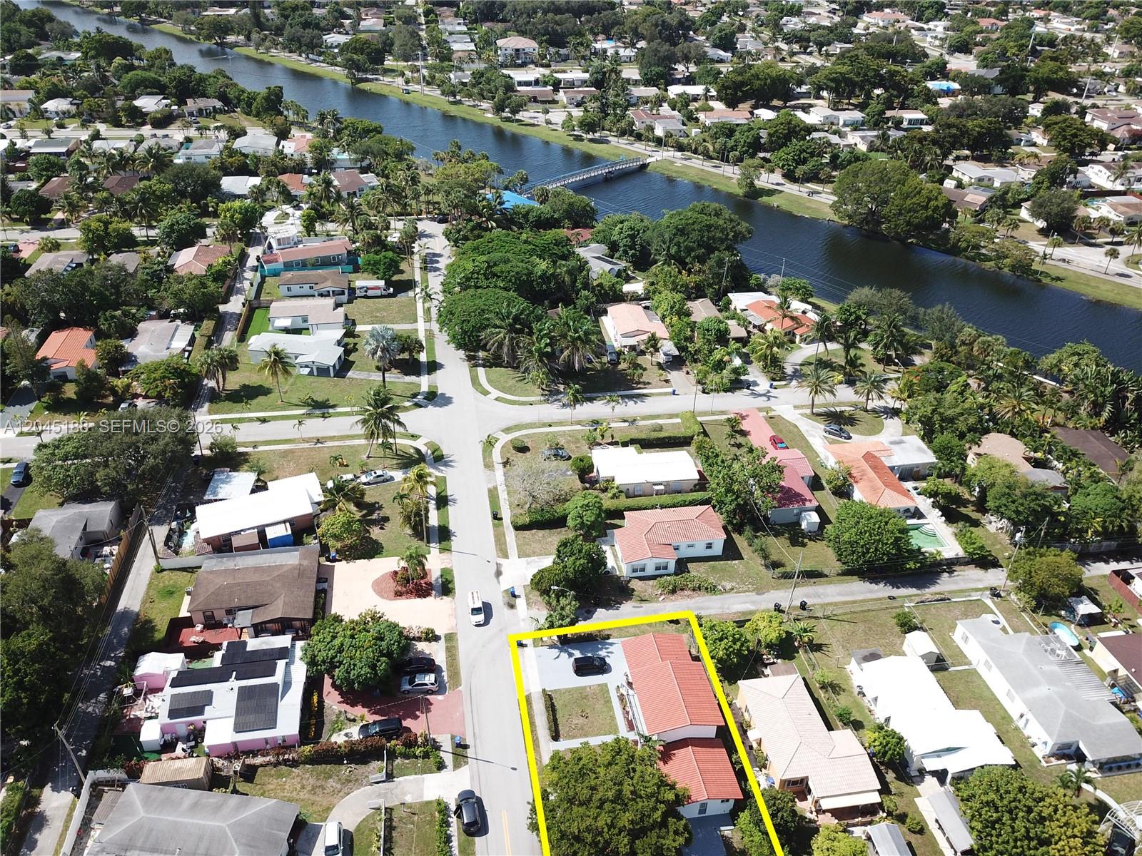 An aerial view shows a residential neighborhood with a canal and a highlighted house — 17880 NE 13th Ave, North Miami Beach FL 33162, NORTH MIAMI BEACH, FL