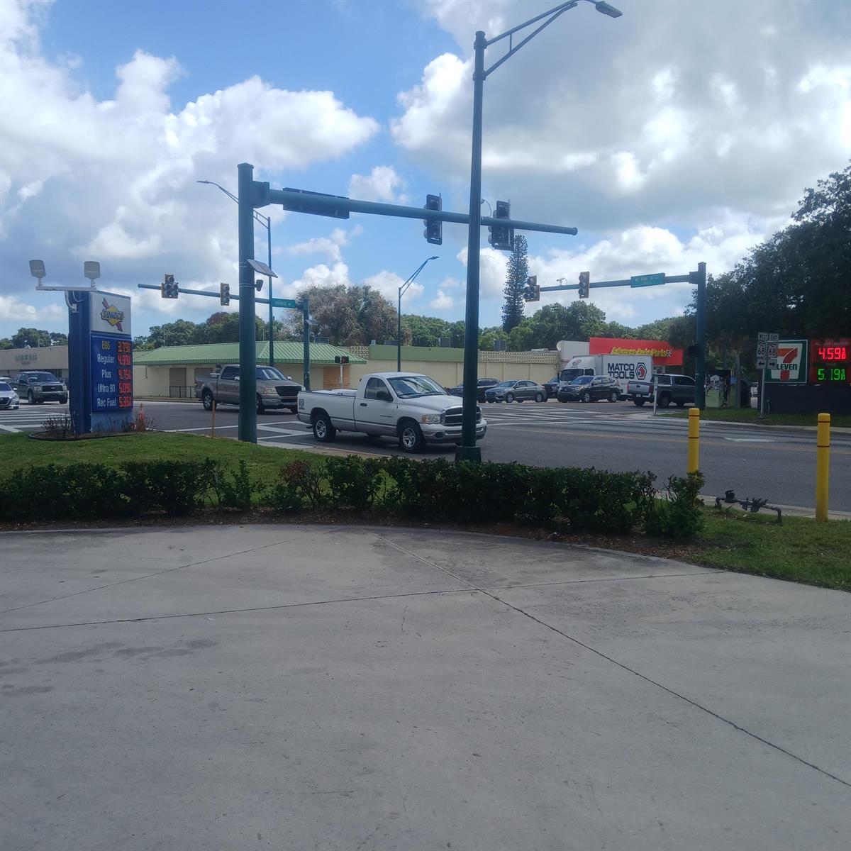 A view of a street intersection with a Sunoco gas station and a 7-Eleven — 2501 Orange Avenue, Fort Pierce FL 34947, FORT PIERCE, FL