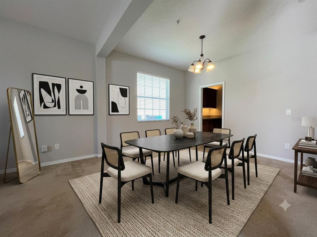 A dining room features a black marble table, six chairs, and framed abstract wall art — 10411 KRISTEN PARK DRIVE, ORLANDO, FL