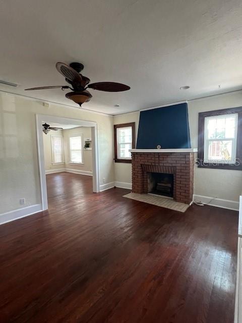A living room features hardwood floors, a brick fireplace, and a ceiling fan — 4748 7TH AVENUE N, ST PETERSBURG, FL