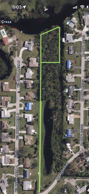 An aerial map shows a long, narrow, undeveloped lot highlighted in green near a pond — STRATFORD ROAD, ENGLEWOOD, FL