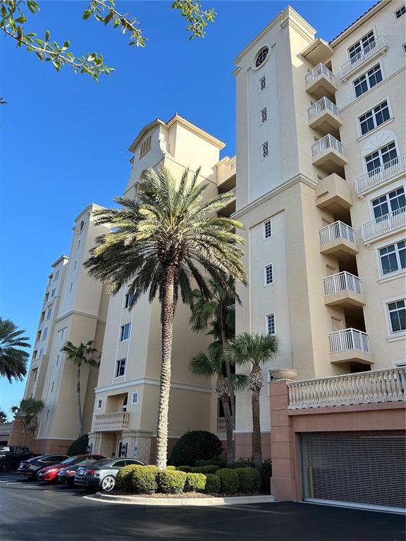 An aerial view shows a multi-building residential complex located near the ocean — 261 MINORCA BEACH WAY UNIT 203, NEW SMYRNA BEACH, FL