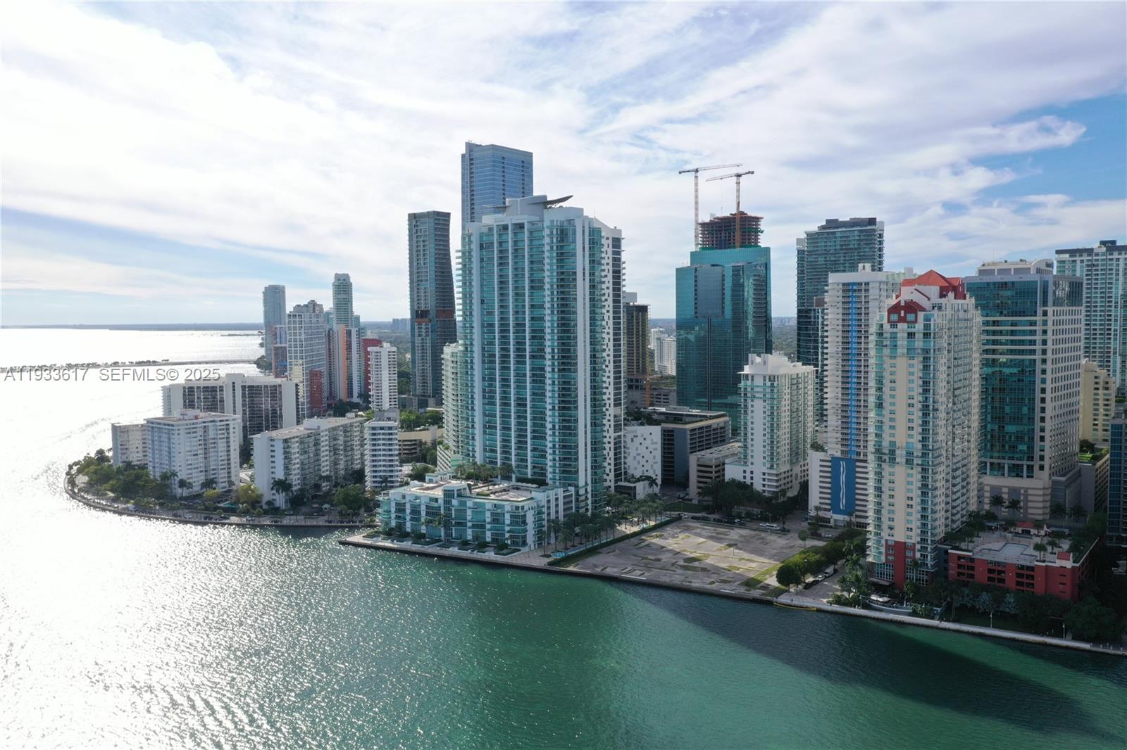 An aerial view shows high-rise residential buildings along a waterfront in a city — 1331 Brickell Bay Dr # 1609, Miami FL 33131, MIAMI, FL