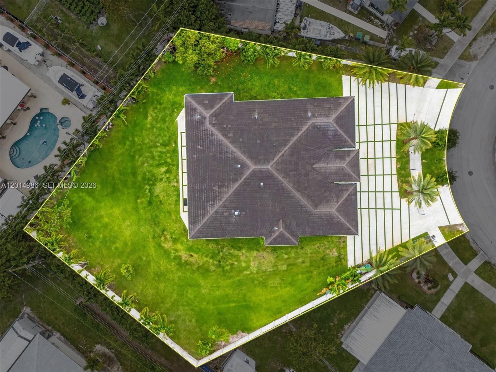 An aerial view shows a house with a dark roof centered on a large lot — 5815 SW 107th Pl, Miami FL 33173, MIAMI, FL