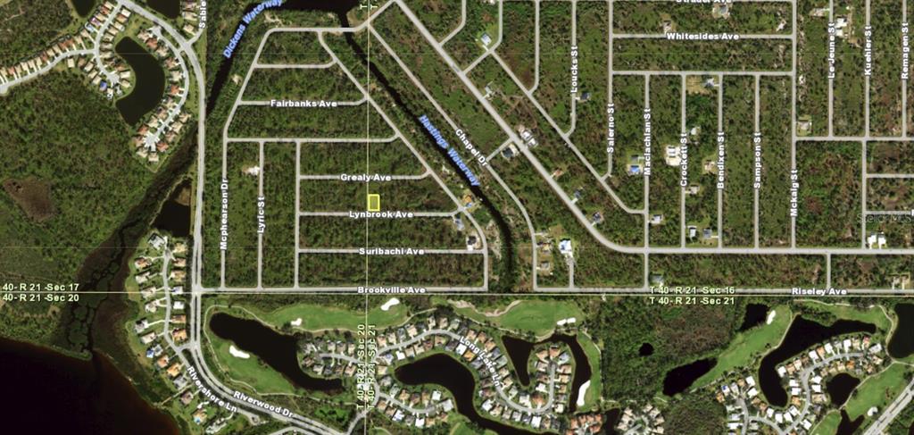This is an aerial map showing a vacant lot highlighted in a residential neighborhood — 13534 LYNBROOK AVENUE, PORT CHARLOTTE, FL