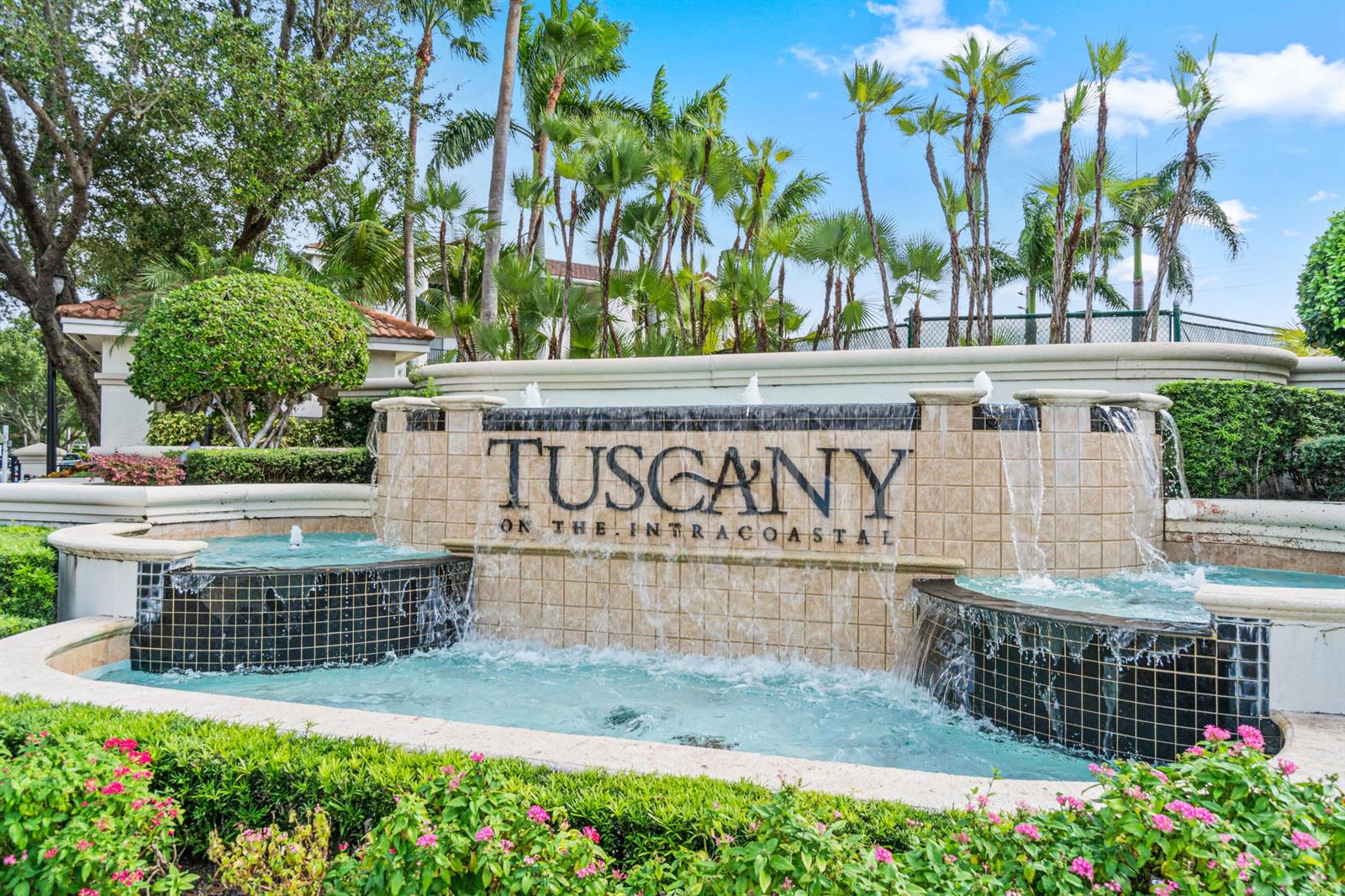 A stone fountain with the text Tuscany on the Intracoastal sits before palm trees — 2408 Tuscany Way # 2408, Boynton Beach FL 33435, BOYNTON BEACH, FL