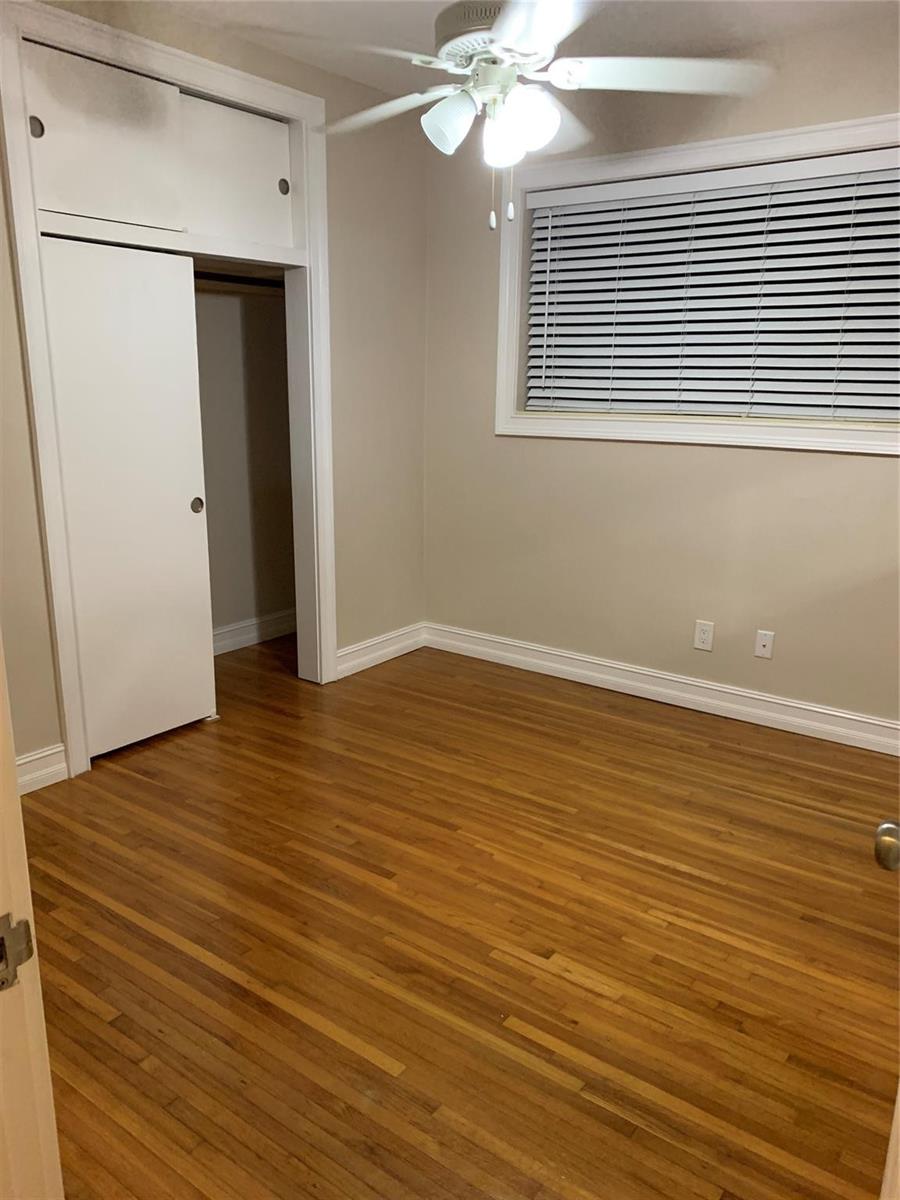 A bedroom with hardwood floors, a ceiling fan, a window with blinds, and a closet — 2910 SW 103rd Place, Miami FL 33165, MIAMI, FL