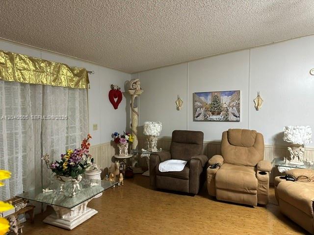 A living room features two recliners, a glass coffee table, and gold window valances — 8002 POGA LN, Sebring FL 33476, SEBRING, FL