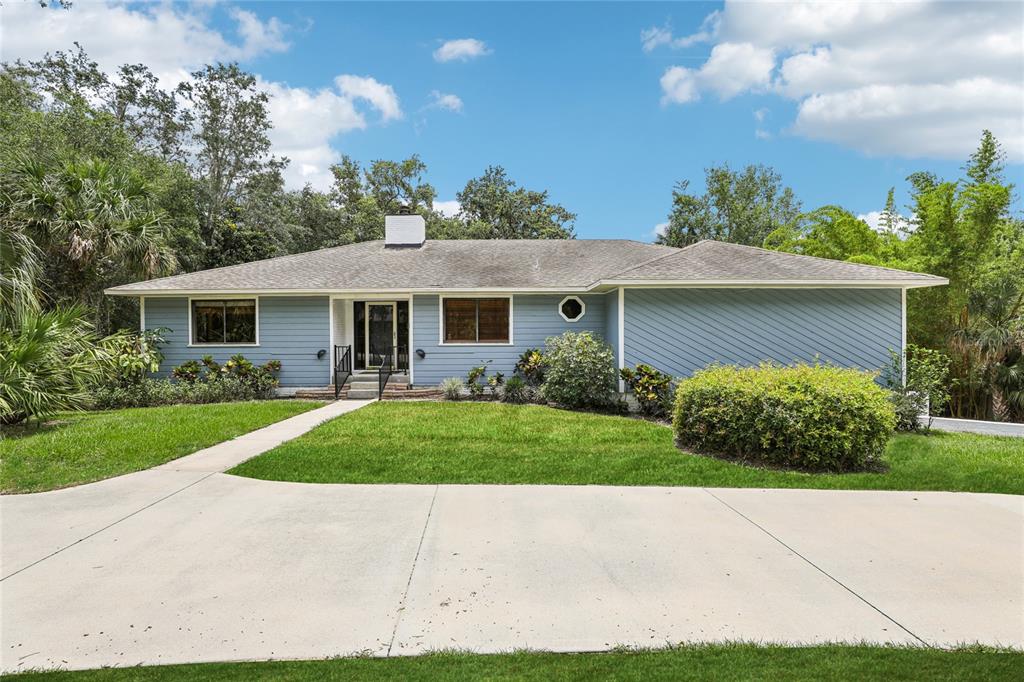 5836 SPRUCE CREEK WOODS DRIVE
