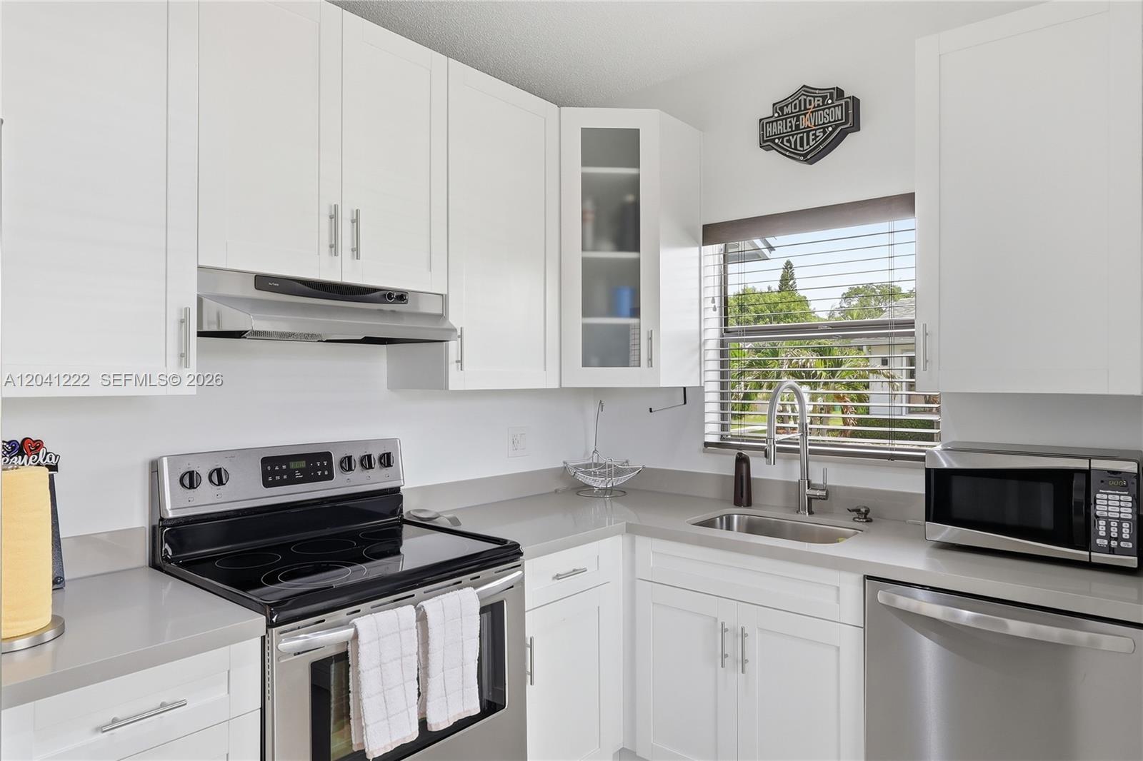 A kitchen with white cabinets, stainless steel appliances, and a window above the sink — 6443 SW 152nd Cir Pl # 43, Miami FL 33193, MIAMI, FL