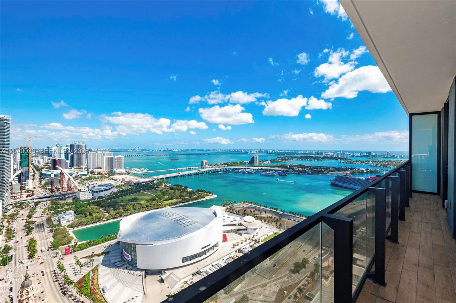 A high-rise balcony overlooks the Kaseya Center, Biscayne Bay, and the Miami skyline — 398 NE 5th St # 4001, Miami FL 33132, MIAMI, FL