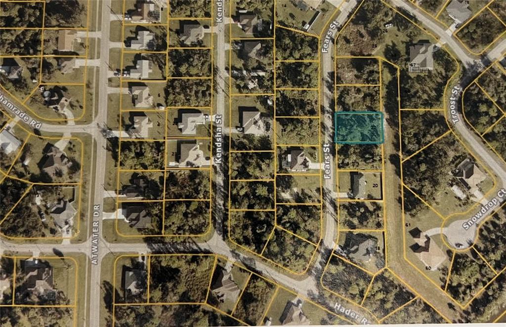 This is an aerial map showing a vacant lot highlighted in blue within a residential neighborhood — FEARS STREET, NORTH PORT, FL