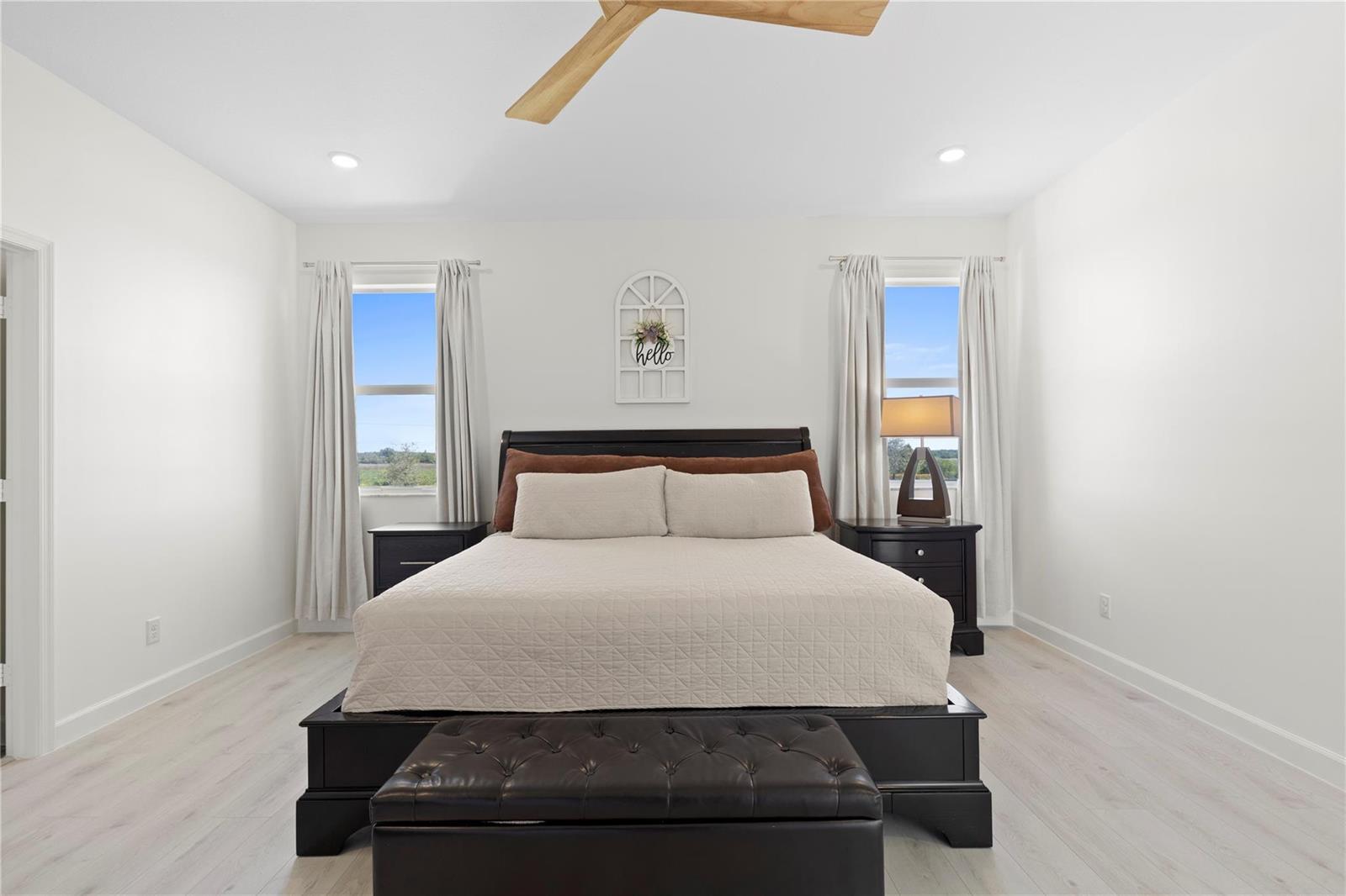 A pantry features white cabinets, a wood countertop, and two floating wood shelves — 1148 Tangled Orchard Trace, Loxahatchee FL 33470, LOXAHATCHEE, FL