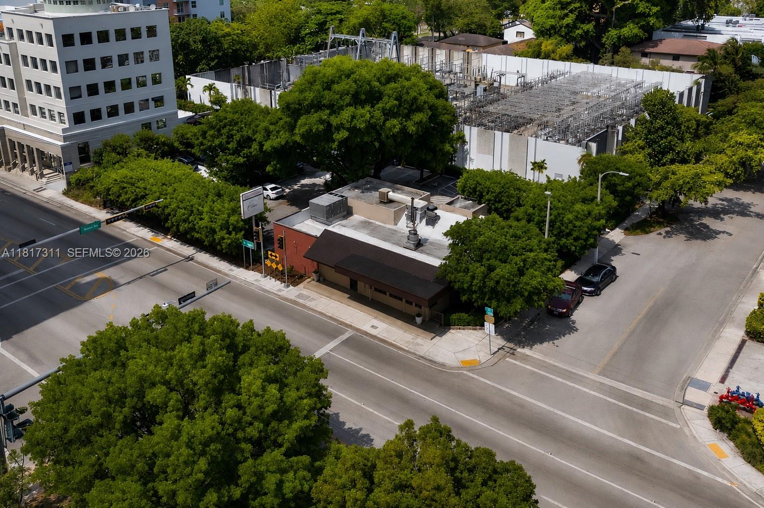 An aerial view shows a commercial building at a street corner near a large office — 2345 SW 37th Ave, Miami FL 33145, MIAMI, FL