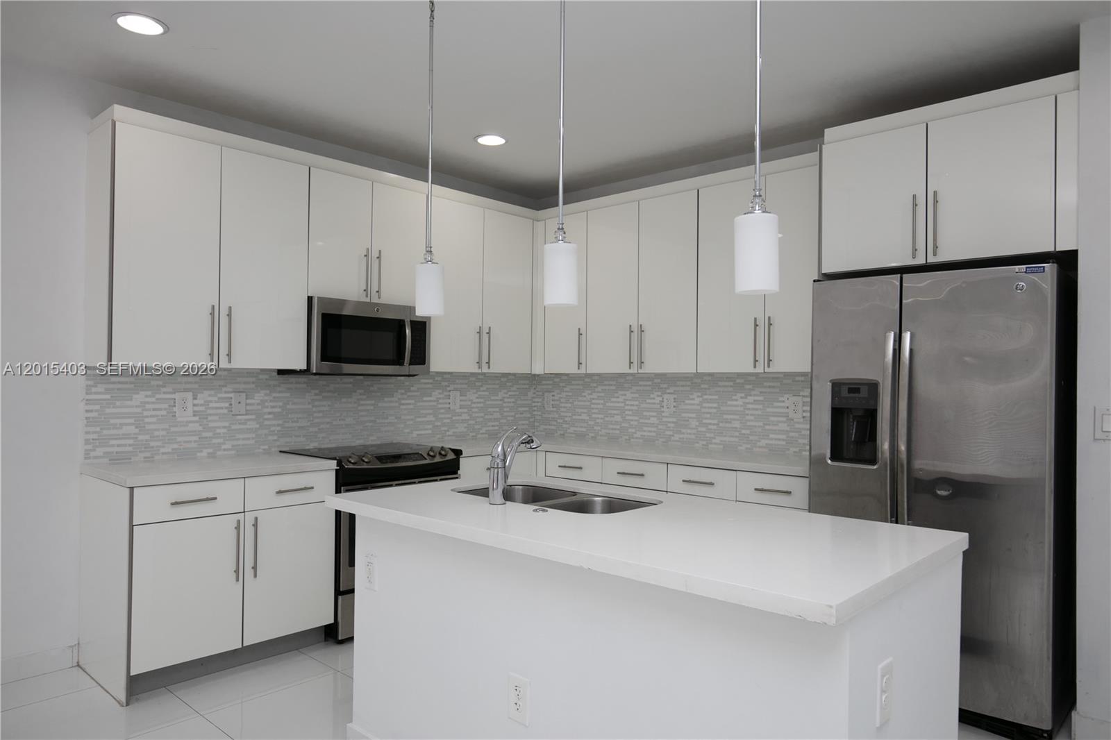This is a virtually staged bedroom featuring a single bed, dresser, and a window — 2610 NE 213th St # 103, Miami FL 33180, MIAMI, FL