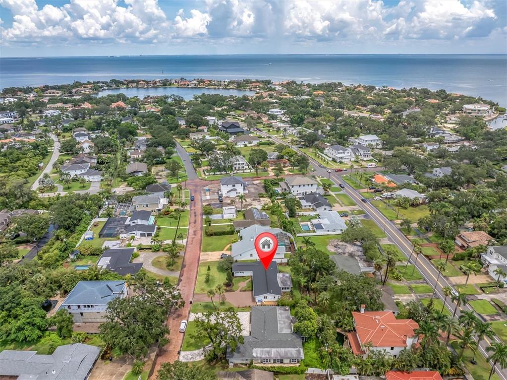 An aerial view shows a residential neighborhood near the coast with a highlighted house — 319 RAFAEL BOULEVARD NE, ST PETERSBURG, FL