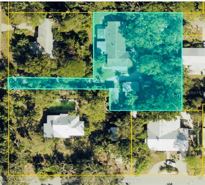 An aerial view shows a residential property lot highlighted in blue with a house — 550 46TH STREET, SARASOTA, FL