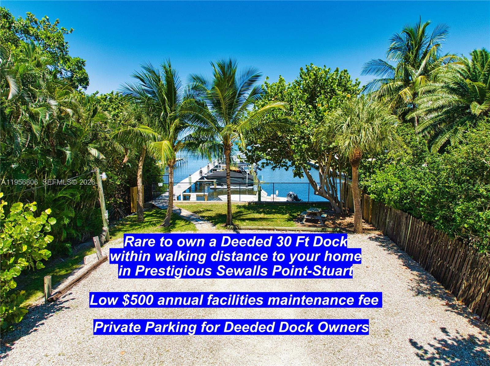 A gravel parking area leads to a private boat dock surrounded by lush tropical trees — 123 S Sewalls Point Rd, Sewalls Point FL 34996, SEWALLS POINT, FL