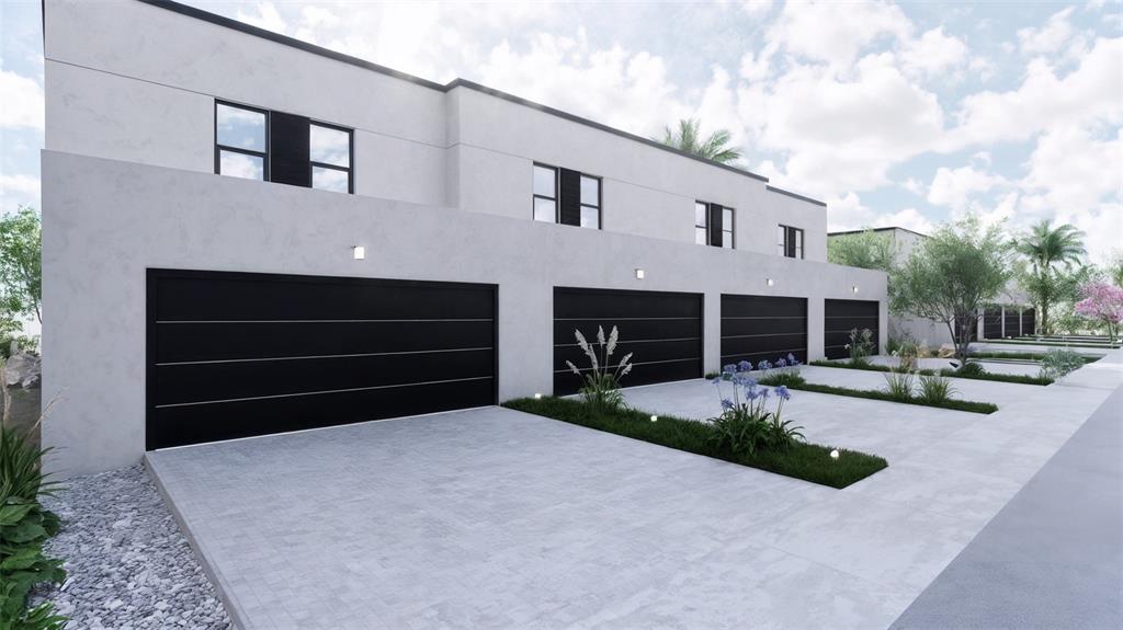 This architectural rendering shows a row of modern townhomes with black garage doors and driveways — 5750 CYRILS ROAD THRL LOT 53, ST CLOUD, FL