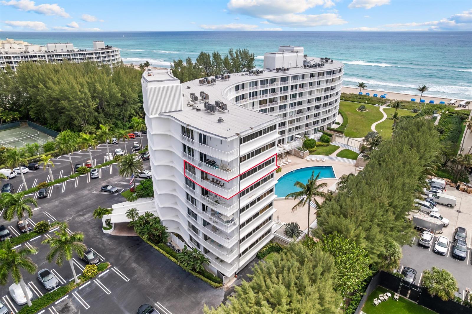 An aerial view shows a curved white beachfront apartment building with a highlighted balcony unit — 2780 S Ocean Boulevard # 612, Palm Beach FL 33480, PALM BEACH, FL
